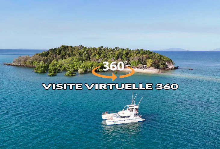 Vue aérienne du catamaran Adventurer devant une île à Nosy Be
